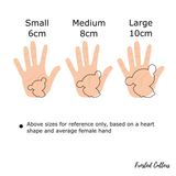 Cute teddy bear hugging a heart cookie cutter with stamp