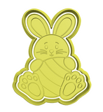 Bunny hugging an egg cookie cutter and stamp
