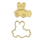 Easter  bunny holding carrot cookie cutter and stamp